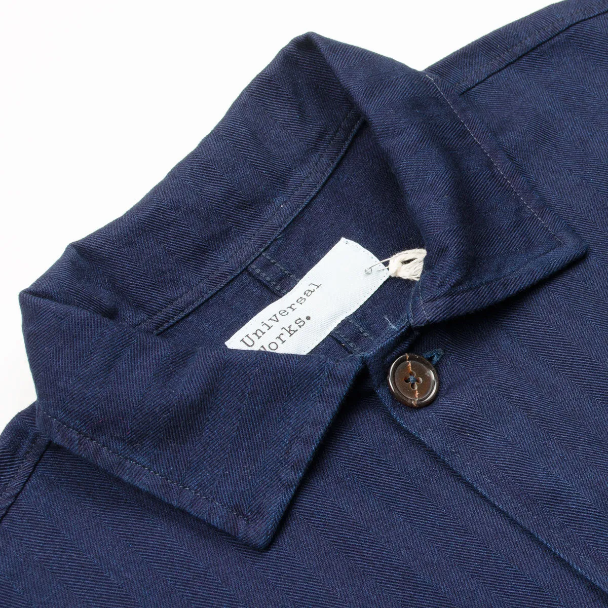 Certainly! Here’s an optimized title for the product:

Universal Works Herringbone Denim Travail Overshirt in Indigo - Stylish and Versatile Workwear